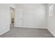 This bedroom includes a doorway to an ensuite bathroom at 139 Satchel Ct, Mooresville, NC 28115