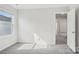 Bright bedroom with gray carpet and light walls with a view to a neighboring home at 139 Satchel Ct, Mooresville, NC 28115