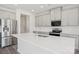 Modern kitchen with stainless steel appliances, quartz countertops, and a large kitchen island at 139 Satchel Ct, Mooresville, NC 28115