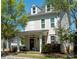 Charming two-story home boasts a cozy front porch, well-kept lawn, and inviting curb appeal at 1424 South St, Cornelius, NC 28031