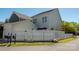 Rear exterior with white fence and gate, showcasing the home's curb appeal at 1424 South St, Cornelius, NC 28031
