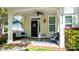 Inviting front porch features a swing, seating, and a welcoming entryway with stylish decor at 1424 South St, Cornelius, NC 28031