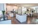 Open kitchen view showcasing the center island and stainless steel refrigerator at 1424 South St, Cornelius, NC 28031