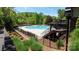 Community pool surrounded by lush greenery and lounge chairs for ultimate relaxation at 1424 South St, Cornelius, NC 28031
