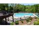 Community pool with inviting lounge chairs and a lush landscape, creating a relaxing atmosphere at 1424 South St, Cornelius, NC 28031