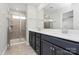 Bathroom featuring double sinks and a tiled shower with glass door at 147 Morning Gap Pkwy, Fort Mill, SC 29715