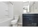 Cozy bathroom with a bathtub and a navy blue vanity at 147 Morning Gap Pkwy, Fort Mill, SC 29715