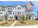 Charming townhomes with colorful exteriors, landscaped yards, and inviting walkways at 147 Morning Gap Pkwy, Fort Mill, SC 29715