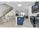 Open concept kitchen with granite island overlooking a living area at 147 Morning Gap Pkwy, Fort Mill, SC 29715
