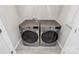 Bright laundry room featuring modern washer and dryer units at 147 Morning Gap Pkwy, Fort Mill, SC 29715