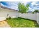 A view of the home's rear exterior and backyard with a white privacy fence at 1526 Tuckers Glenn Dr, Rock Hill, SC 29732