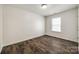 Clean bedroom with wood-look floors, neutral walls, and ample natural light from a window at 1526 Tuckers Glenn Dr, Rock Hill, SC 29732
