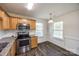 Well-lit kitchen area with stainless steel appliances, white subway tile backsplash, and an eat-in dining area at 1526 Tuckers Glenn Dr, Rock Hill, SC 29732