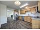 Open kitchen with stainless steel appliances, granite countertops, wood floors, and a view of the living room at 1526 Tuckers Glenn Dr, Rock Hill, SC 29732