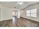 Open living room with natural light, hardwood floors, and view into the dining area at 1526 Tuckers Glenn Dr, Rock Hill, SC 29732