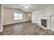 Spacious living room with a fireplace and wood-look flooring, perfect for entertaining at 1526 Tuckers Glenn Dr, Rock Hill, SC 29732