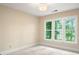 Bright bedroom with large windows and ample natural light showcasing a neutral color palette at 15535 Eagleview Dr, Charlotte, NC 28278