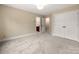 Spacious bedroom with neutral walls and carpet, featuring an ensuite bathroom and closet at 15535 Eagleview Dr, Charlotte, NC 28278