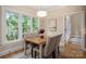 Dining room with wood table, comfortable seating, hardwood floors and plenty of natural light at 15535 Eagleview Dr, Charlotte, NC 28278