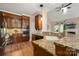 Kitchen with granite countertops, stainless appliances, wood cabinets and an eat-in desk space at 15535 Eagleview Dr, Charlotte, NC 28278