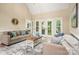 Comfortable living room area filled with natural light featuring hardwood floors and neutral paint at 15535 Eagleview Dr, Charlotte, NC 28278