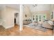 Bright living room features hardwood floors, neutral decor, and French doors to the outside at 15535 Eagleview Dr, Charlotte, NC 28278