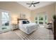 Spacious main bedroom with a tray ceiling, neutral colors, and lots of natural light from many windows at 15535 Eagleview Dr, Charlotte, NC 28278