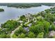 Amazing aerial view of a home with access to a lake; includes a neighborhood full of mature trees and green spaces at 166 Wilson Lake Rd, Mooresville, NC 28117