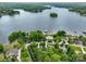 Breathtaking aerial view of a waterfront property surrounded by lush greenery and a serene lake at 166 Wilson Lake Rd, Mooresville, NC 28117