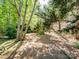 Gravel path provides a quiet spot to relax and unwind in the backyard at 166 Wilson Lake Rd, Mooresville, NC 28117