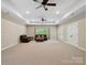 Finished basement area with recessed lighting, lots of space, seating, and access to the backyard at 166 Wilson Lake Rd, Mooresville, NC 28117