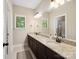 Bathroom boasts double sinks and granite countertop, with natural light at 166 Wilson Lake Rd, Mooresville, NC 28117