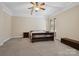 A comfortable bedroom with neutral walls, carpet, natural light streaming through the window and a ceiling fan at 166 Wilson Lake Rd, Mooresville, NC 28117
