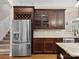 Spacious kitchen with stainless steel appliances and dark wood cabinets, including a wine rack at 166 Wilson Lake Rd, Mooresville, NC 28117