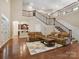 Spacious living room with soaring ceilings, hardwood floors, and a cozy fireplace at 166 Wilson Lake Rd, Mooresville, NC 28117