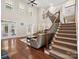 Spacious living room with soaring ceilings, hardwood floors, and staircase at 166 Wilson Lake Rd, Mooresville, NC 28117