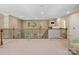 Loft area with carpeted floors, wood railing, and plenty of natural light beaming through multiple windows at 166 Wilson Lake Rd, Mooresville, NC 28117