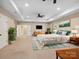 Spacious main bedroom boasts a tray ceiling, ceiling fan, and serene decor at 166 Wilson Lake Rd, Mooresville, NC 28117