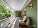Covered porch with multiple chairs is perfect for outdoor relaxation at 166 Wilson Lake Rd, Mooresville, NC 28117