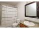 Bathroom featuring shower/tub with decorative shower curtain, wooden vanity, and framed mirror at 1965 Leesburg Dr, Clover, SC 29710