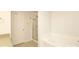 Bathroom featuring a glass-enclosed shower and tub at 1965 Leesburg Dr, Clover, SC 29710