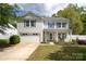 Charming two-story home featuring a well-manicured lawn and inviting front porch, offering great curb appeal at 1965 Leesburg Dr, Clover, SC 29710