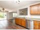 Well-lit kitchen featuring stainless steel appliances, wooden cabinets, and hardwood flooring at 1965 Leesburg Dr, Clover, SC 29710