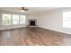 Expansive living room with a cozy fireplace and plenty of natural light, great for entertaining at 1965 Leesburg Dr, Clover, SC 29710
