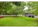 Expansive backyard featuring lush green lawn and a white picket fence at 2150 Quiet Creek Pl, Rock Hill, SC 29732
