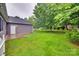 Backyard features a well-maintained lawn with a patio space near the house at 2150 Quiet Creek Pl, Rock Hill, SC 29732