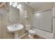 Bathroom with a pedestal sink, toilet, and a shower featuring sliding glass doors at 2150 Quiet Creek Pl, Rock Hill, SC 29732