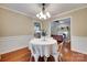Charming dining room with wainscoting, hardwood floors, and views of the living room at 2150 Quiet Creek Pl, Rock Hill, SC 29732