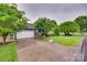 Spacious driveway leading to a two-car garage, surrounded by mature trees and lush landscaping at 2150 Quiet Creek Pl, Rock Hill, SC 29732