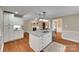 Open kitchen boasts a granite island, stainless steel appliances, and view into the adjacent living space at 2150 Quiet Creek Pl, Rock Hill, SC 29732